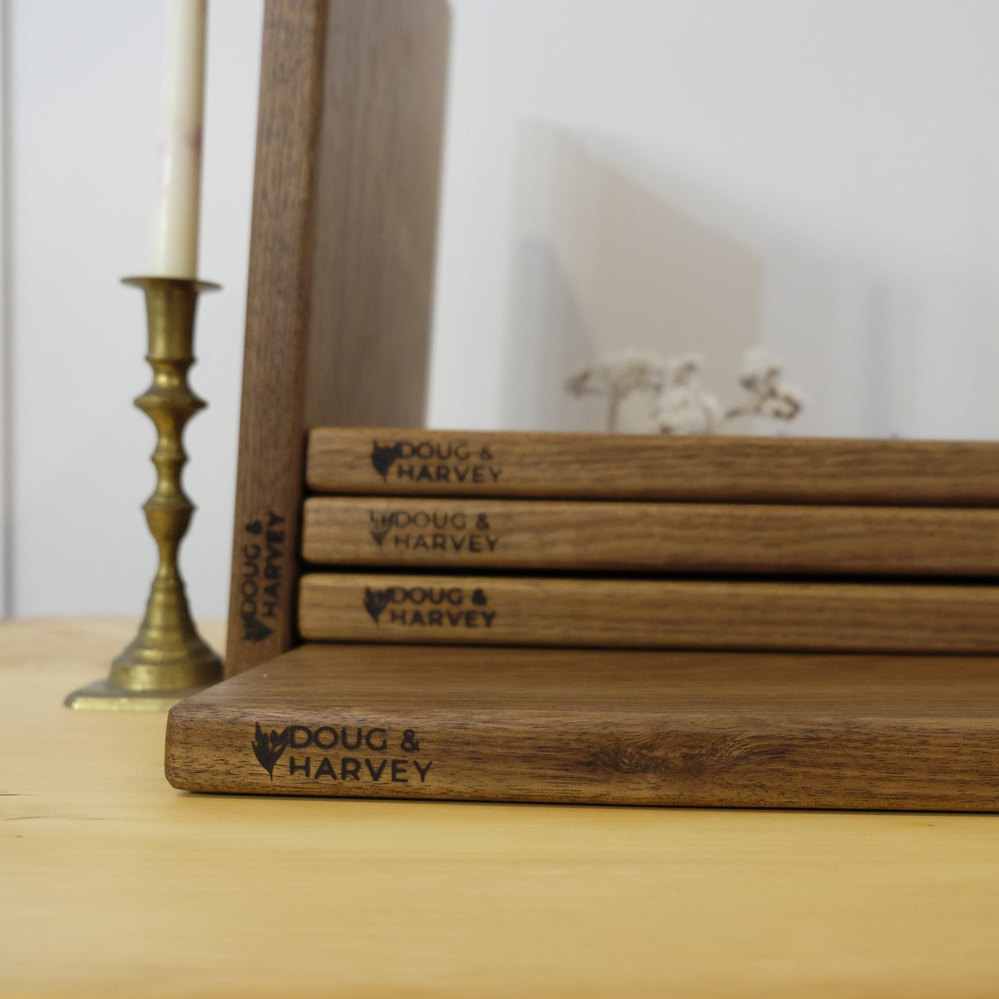 Wooden books with 'Doug & Harvey' branding on a wooden surface chopping board tasmania bicheno