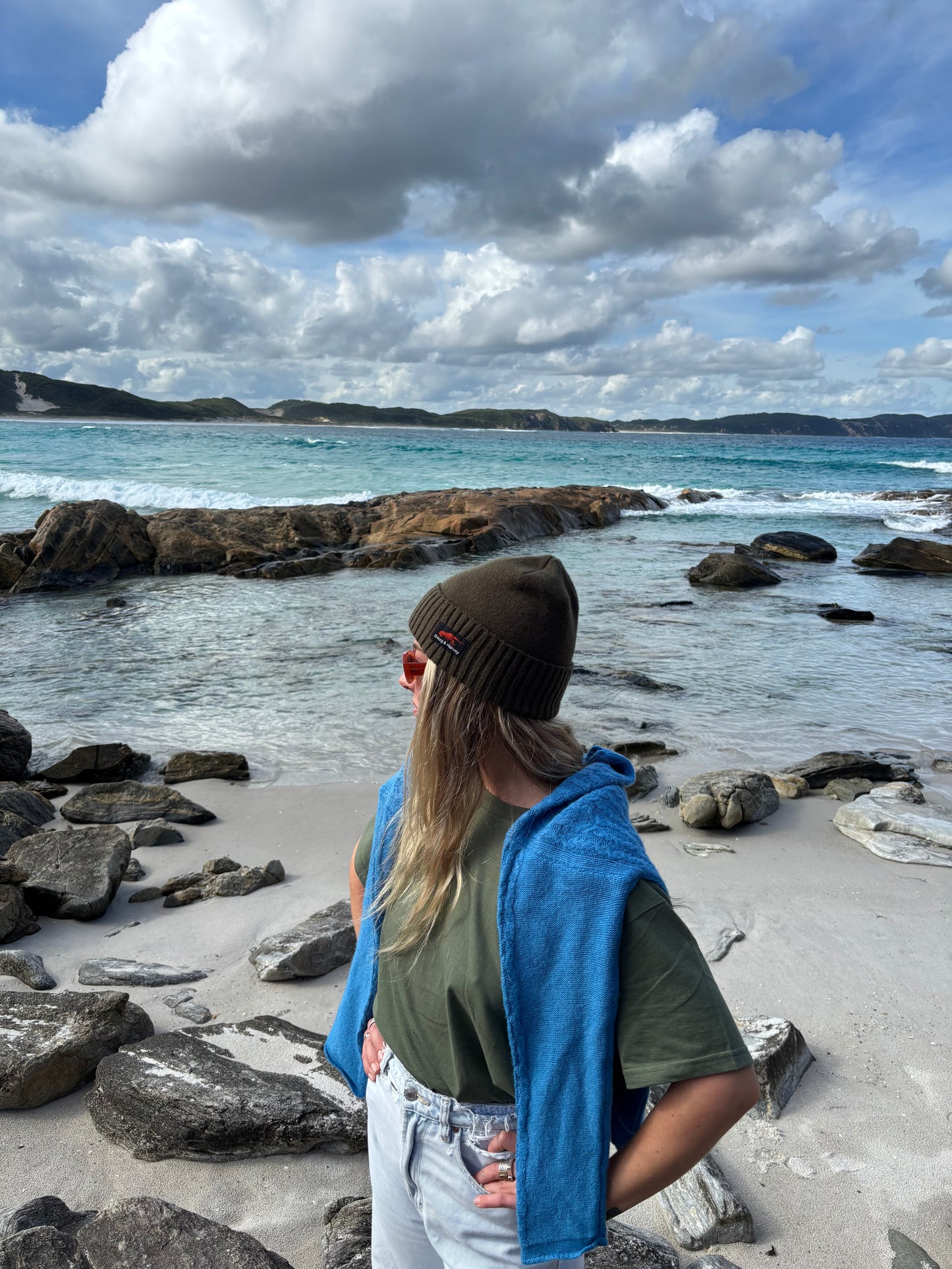 Tasmanian beach lifestyle wearing olive beanie