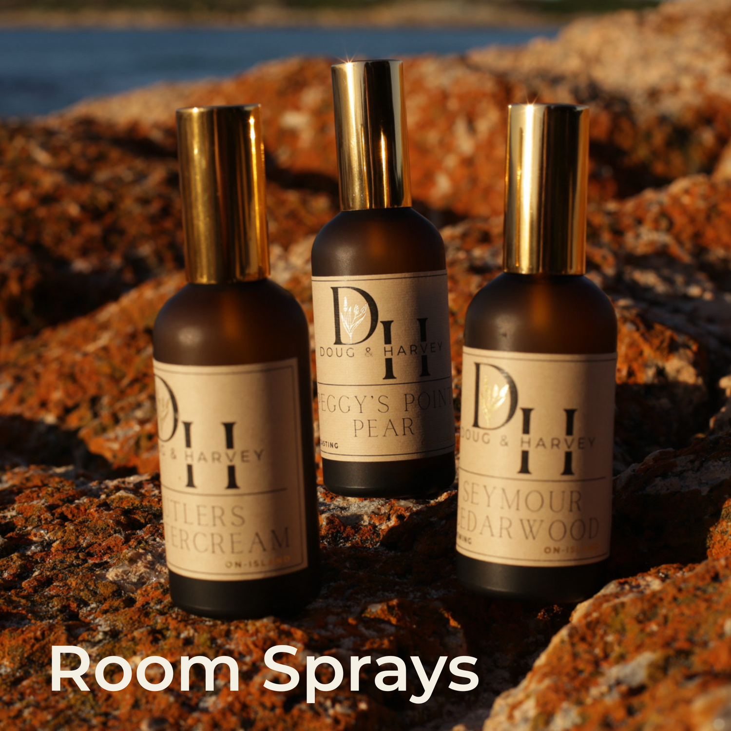 3 Butlers Buttercream Room Sprays set on wooden table with white wall behind
