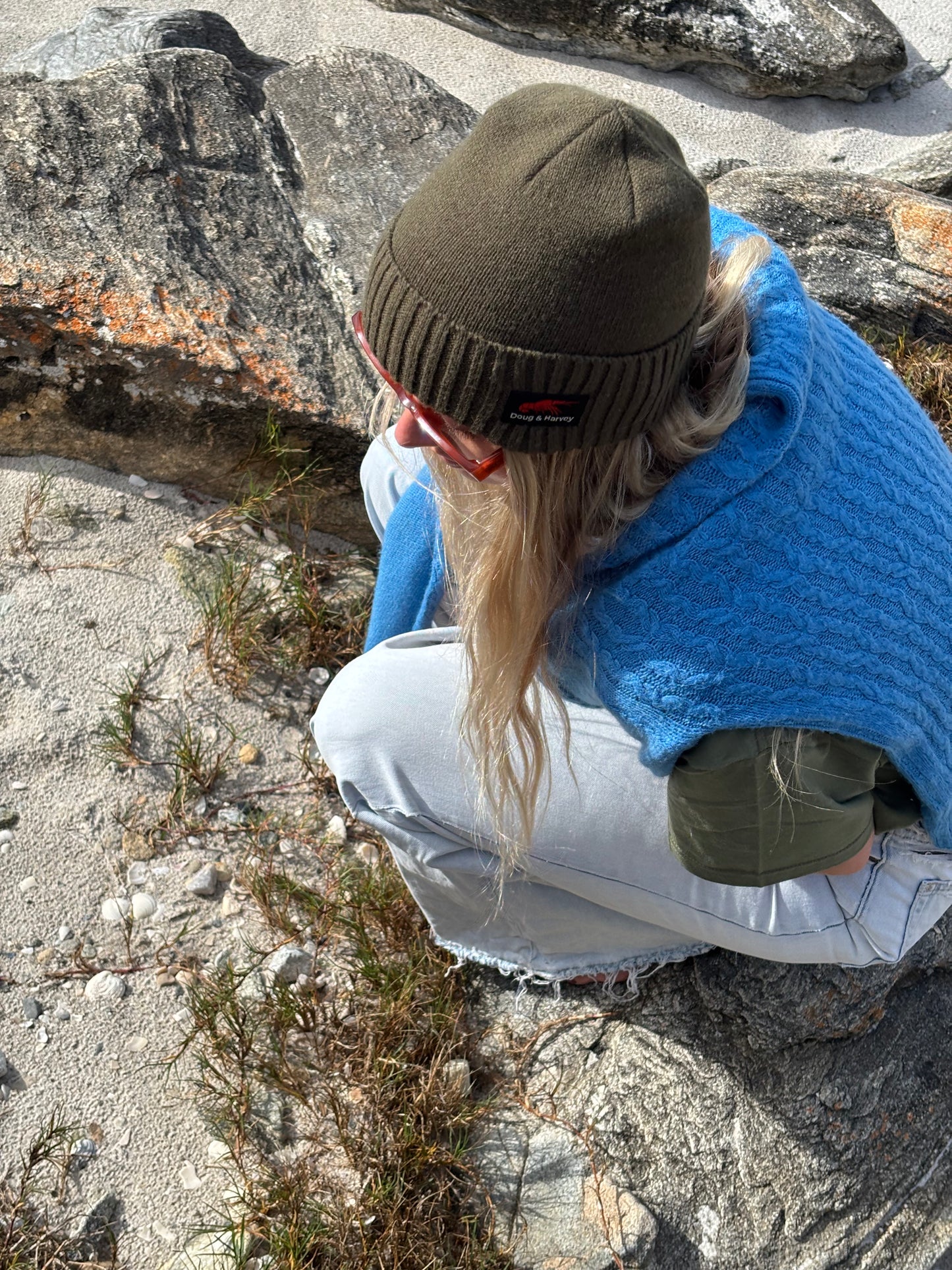 Close-up olive wool blend beanie texture and fit