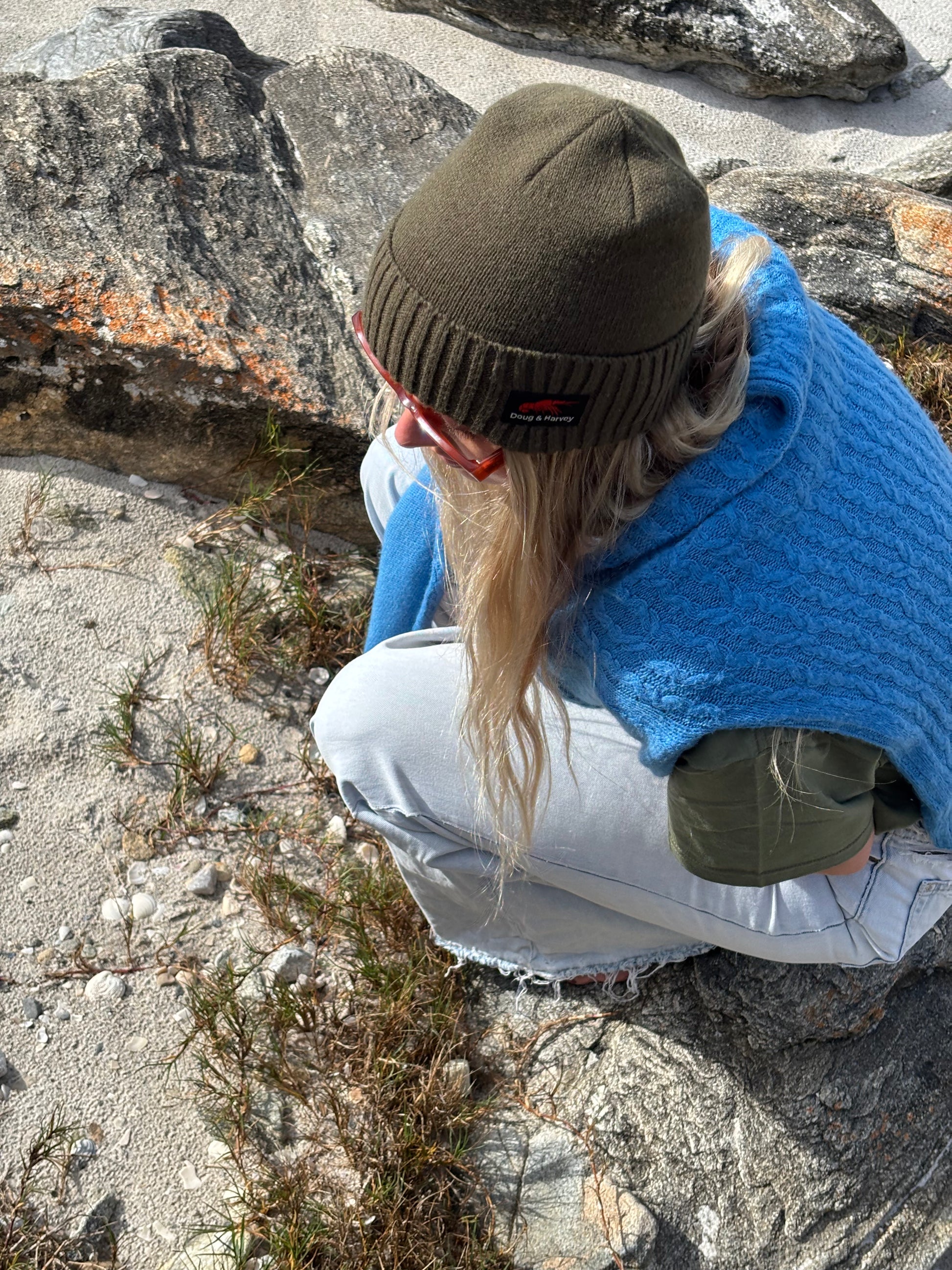 Close-up olive wool blend beanie texture and fit