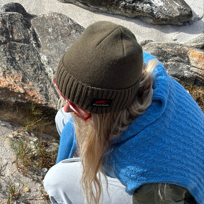 Close-up olive wool blend beanie texture and fit