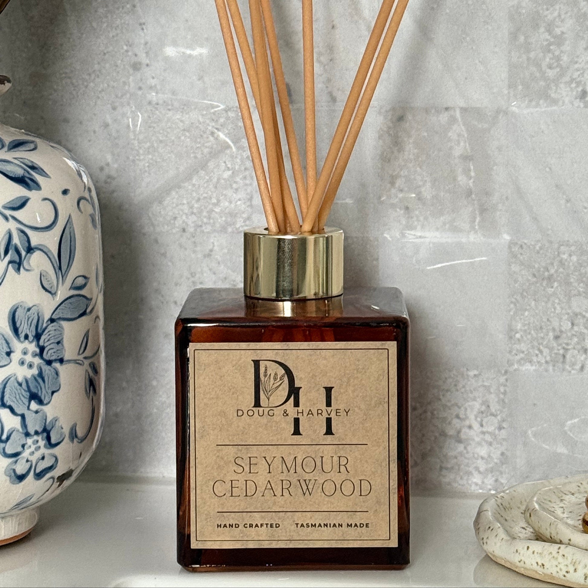 Diffuser with wooden sticks on a marble surface