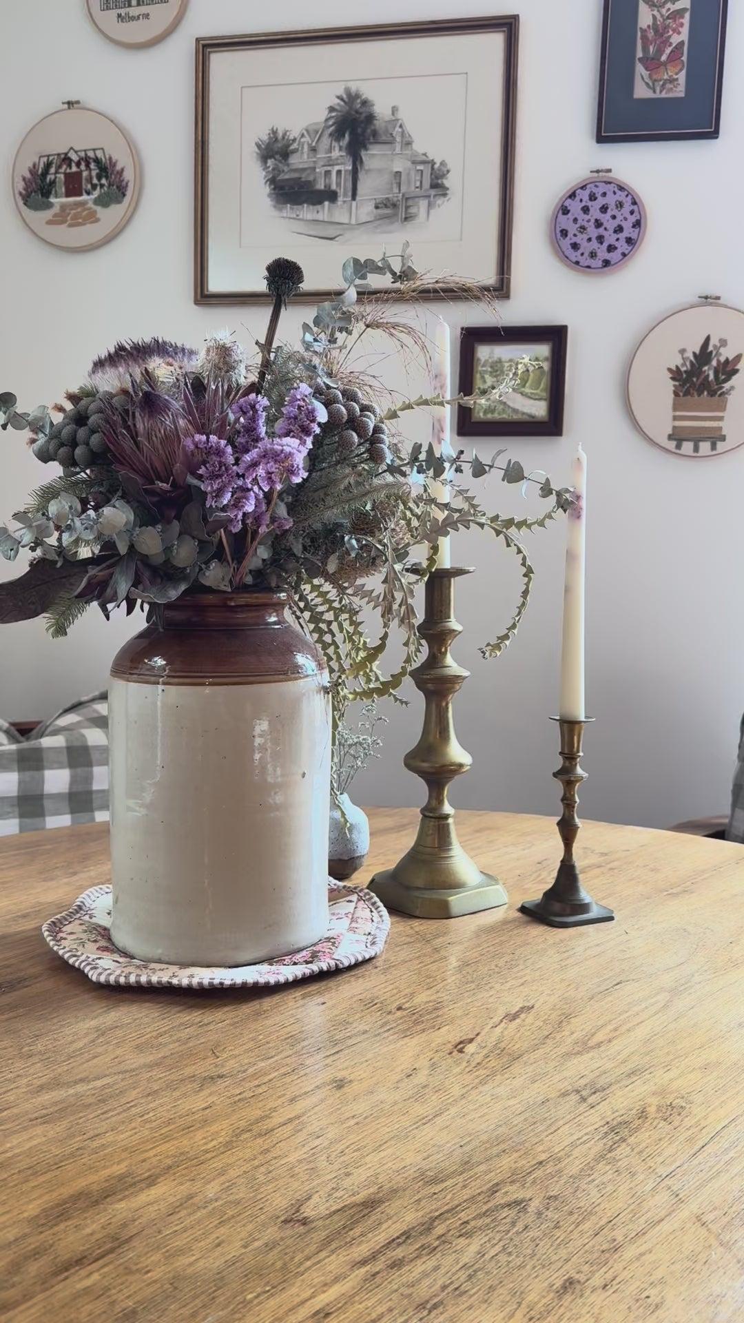 Inserting rattan reeds into butlers buttercream natural reed diffuser with a country table backdrop

